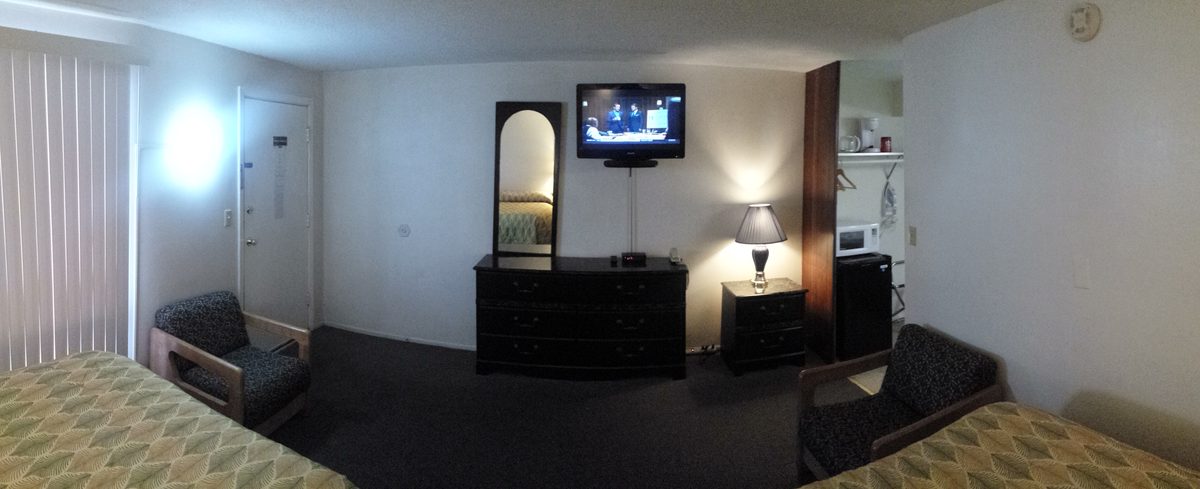 Room dresser, TV, and seating area